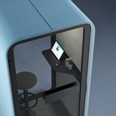 an office cubicle with a computer on the desk