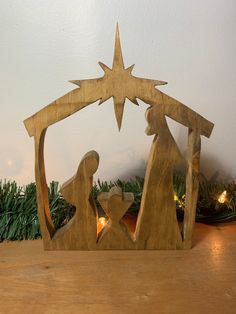 a wooden nativity scene with the birth of jesus