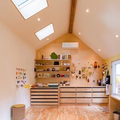 a room with wooden floors and shelves on the wall