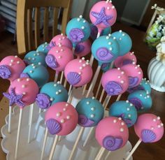 cake pops with pink, blue and purple decorations