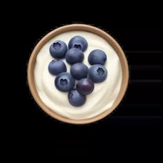 blueberries and cream in a bowl on a white background