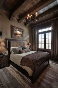 a bedroom with a large bed and chandelier