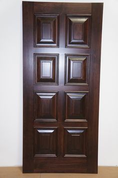 a close up of a wooden door on a wall