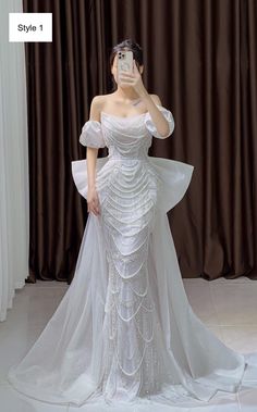 "By purchasing, you agree to have read and understood the terms set out in our store policies and FAQs. If you're not happy with the terms, please do not proceed. Beautiful custom made wedding gown/dress!  Embrace an elegant and unique look in any of these white mermaid wedding dresses. Style 1: - Off the shoulder - Removable puffy sleeves - Pearls throughout - Shimmering sequin tulle - Lace-up back - Detachable train with bow at back Style 2: - Off the shoulder - Pearls throughout - Shimmering White Mermaid Mesh Prom Dress, Luxury Mermaid Hem Sequin Wedding Dress, Mermaid Wedding Dresses With Detachable Train, Wedding Dresses Mermaid Sparkly, Rhinestone Wedding Dress Pearl, Mermaid Prom Dress White Poffy, White Fitted Luxury Princess Dress, Luxury Embellished White Pageant Dress, Luxury White Prom Dress