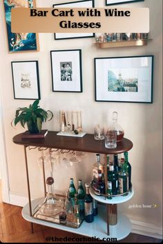 A bar cart equipped with wine glasses, designed  for easy maneuverability. The cart appears to be stylish and organized, making it a perfect addition for serving and storing beverages in a home or entertainment setting. The wine glasses give a sophisticated touch to the overall presentation of the bar cart. Bar Table Interior Design, Bar Cart Corner Living Room, Apartment Liquor Bar, Small Bar Corner Ideas For Home, Small Space Bar Cart, Bar Wall Apartment, Bar Cart Living Room Decor, Bar Cart Dining Room Ideas, Apartment Bar Set Up