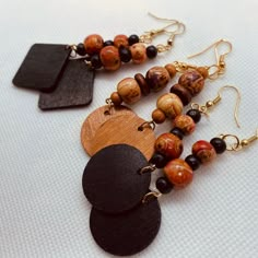 Wood bead Earrings came in printed designs on beads. Earrings hang  at 2in long. Very light weight. Wooden Beads Round Beaded Earrings As Gift, Adjustable Wooden Beaded Earrings As Gift, Unique Wooden Beads Dangle Jewelry, Gift Wooden Beaded Earrings, Wooden Beads Dangle Earrings, Gift Wooden Beaded Round Earrings, Adjustable Dangle Earrings With Black Beads, Wooden Beads Drop Earrings, Wood Earrings Diy