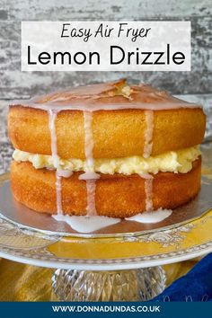 lemon drizzle cake on a plate with the words easy air fryer lemon drizzle