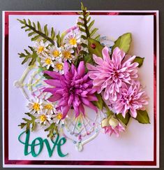 a card with flowers and the word love on it