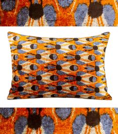 an orange and blue pillow sitting on top of a white floor next to another pillow