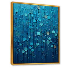 an abstract painting with blue and green circles on it's surface, framed in gold