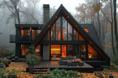 a house in the woods with lots of windows and lights on it's roof