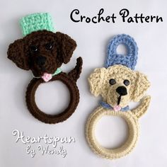 two crocheted dogs with rings on them and one has a dog's head