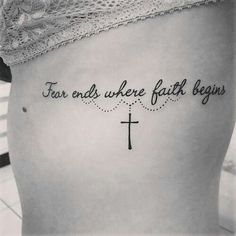 a woman with a cross tattoo on her stomach that says, fear ends where faith begins