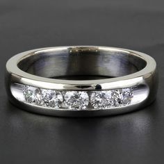 a white gold wedding band with channeled diamonds