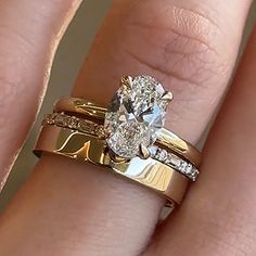 a woman's engagement ring and wedding band set