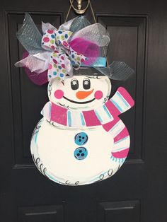 a door hanger with a snowman on it