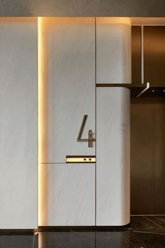 the number four is mounted to the wall in this modern kitchen