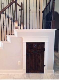 an open door in the middle of a room with stairs and railings on either side