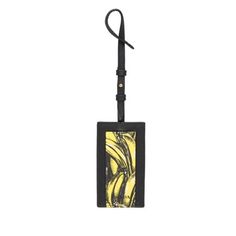 This sophisticated Banana Printed Saffiano leather name tag with the iconic Prada motif is part of the My Character Collection. It can be customizable with My Character elements. This is typically used as a luggage tag but it can also be used as a an I.D. holder. My Character Collection 1EN023 Giallo Dis Banana/Banana Print 4" Black Strap Black/Yellow Dimensions: 4"x.3"x2.3"(LWH) Made in Italy Includes Authenticity Card and Prada box Gender: female.  Age Group: adult. Name Tag Keychain, Banana Print, My Character, Character Collection, Gold Ounce, Handbag Wallet, Wallet Accessories, Name Tag, Key Card Holder