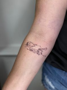 a woman with a tattoo on her arm