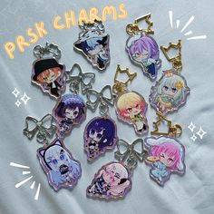 a bunch of key chains with anime characters on them