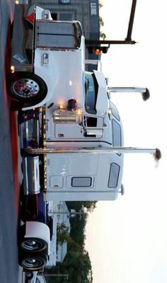 a white truck is parked on the side of the road