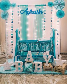 a baby's room decorated with blue and white decorations