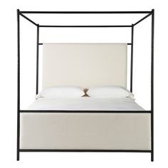 an iron bed frame with two pillows on the top and bottom side, against a white background