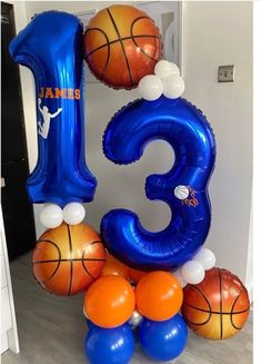 the number three balloon is made up of basketballs and balloons, with an orange ball on top