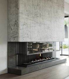 a modern fireplace in the middle of a room