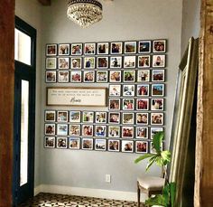 a room with pictures on the wall and a chandelier