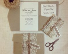 the wedding stationery is laid out on top of the table with twine and scissors