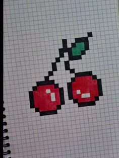 a notebook with an image of two cherries on it