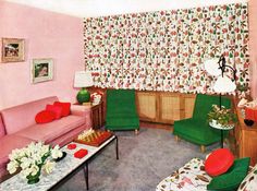 a living room with pink walls and green chairs