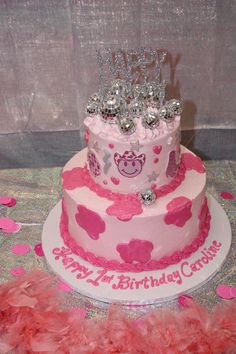 a birthday cake with pink and silver decorations