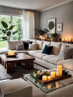 a living room filled with lots of furniture and candles on top of it's coffee table