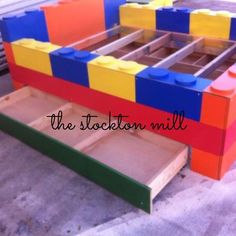 a large lego bed made out of wooden blocks