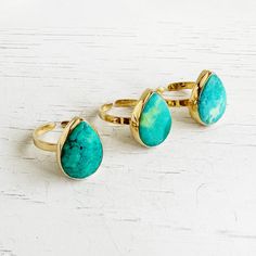 Tibetan Turquoise Teardrop Statement Ring in Gold. Adjustable Gemstone Cocktail Ring Classic and wearable, this stunning ring will definitely make a statement. GEMSTONE: Tibetan turquoise STONE SIZE: 12mmx18mm RING SIZE: Adjustable MATERIAL: Gold plated Also available in Emerald - https://www.etsy.com/listing/1572536664/emerald-teardrop-statement-ring-in-gold Questions?  Please don't hesitate to start a convo, we'd love to hear from you! WELCOME! Welcome to Rustic Gem Jewelry! Thank you for visiting our shop. We take custom orders and can often do a similar piece in different colors. We also offer bulk / bridal discounts. If you have any questions regarding this item, please let us know. We're more than happy to help. MATERIALS We use 14k gold filled chain or sterling silver chain, almost Gem Jewelry, Tibetan Turquoise, Gems Jewelry, Classic Ring, Gold Filled Chain, Ring Collections, Cocktail Ring, Turquoise Stone, Cocktail Rings