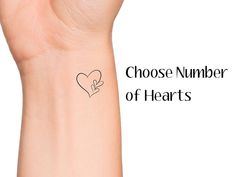 a woman's arm with a tattoo on it that says choose number of hearts