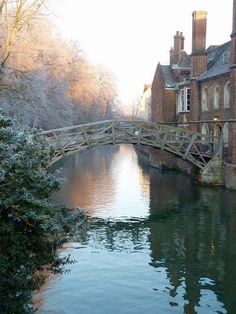 a bridge over a body of water in front of a building