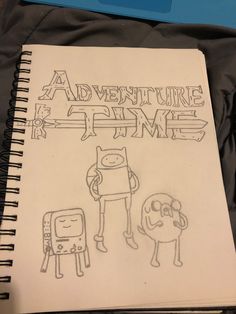 a notebook with the title adventure time written on it next to an image of a cat and dog