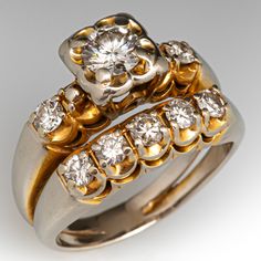 two gold and silver rings with diamonds on them