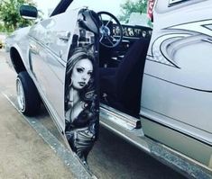 an image of a woman's face on the side of a car door