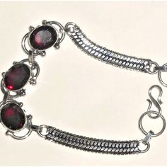 Natural Garnet Bracelet I Paid $80 For And Never Wore It. Selling For Less Than ½ The Price In My Salon Boutique. Stamped .925 Solid Sterling Silver. Fits Wrist 8-8½. Fastens With Classic S Shaped Clasp Style. This Is A Very Fair Price. You Can Bundle More Items, P To 5 Lbs And Pay Only One Time For S&H. I Don't Often Send Offers To Likers. Please Visit Our Sister Closet: @Gems_of_glory Thanks For Looking. #Red Garnet #Sterling Silver Adjustable Red Oval Bracelet, Adjustable Red Oval Bracelets, Nickel-free Red Sterling Silver Bracelet, Red Garnet Bracelets As Gift, Red Garnet Bracelet As Gift, Red Garnet Bracelet Gift, Red Garnet Bracelet For Gift, Handmade Silver Garnet Bracelets, Formal Silver Garnet Bracelets