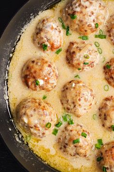 a pan filled with meatballs covered in sauce