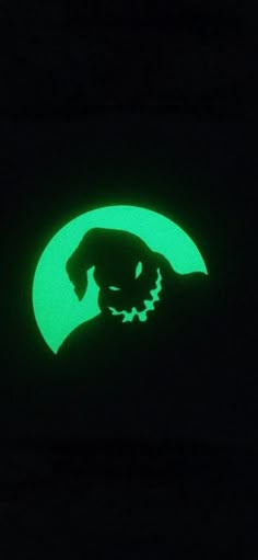 a black and green image of a dog in the dark