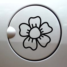 a flower sticker on the side of a car door