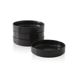 two black bowls sitting next to each other