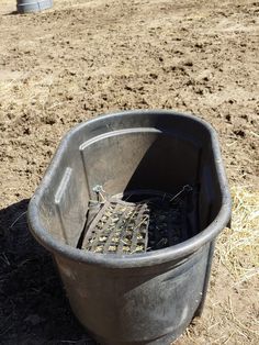 there is a bucket with some shoes in it