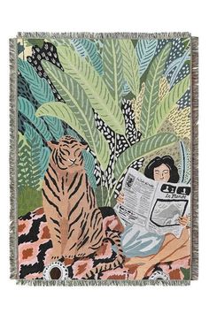 a woman reading a book with a tiger on the ground next to her and plants in the background